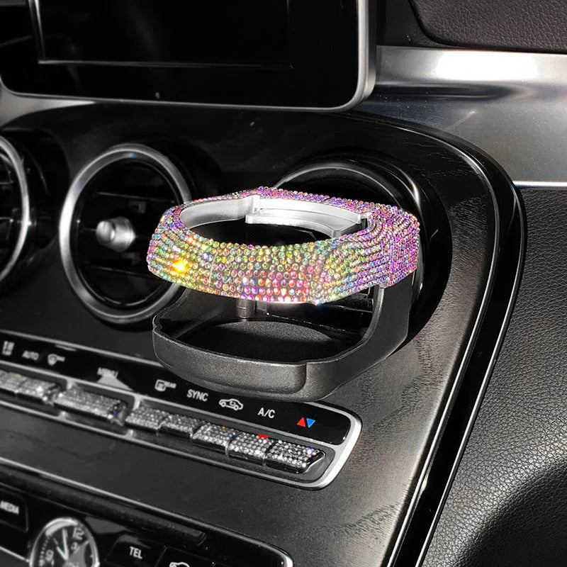 White diamond encrusted ABS plastic car cup holder mounted on a vehicle air vent.