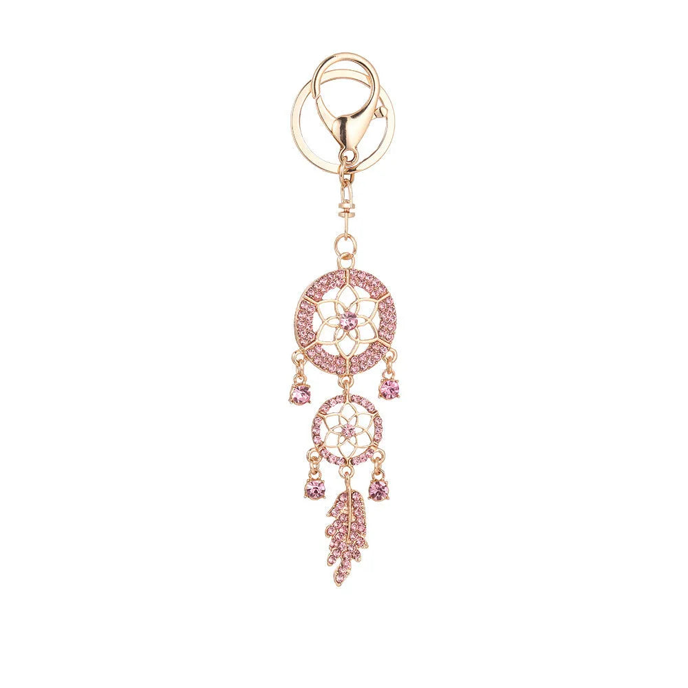 Creative diamond studded flower shaped car keychain dream catcher in pink alloy light luxury style on white background