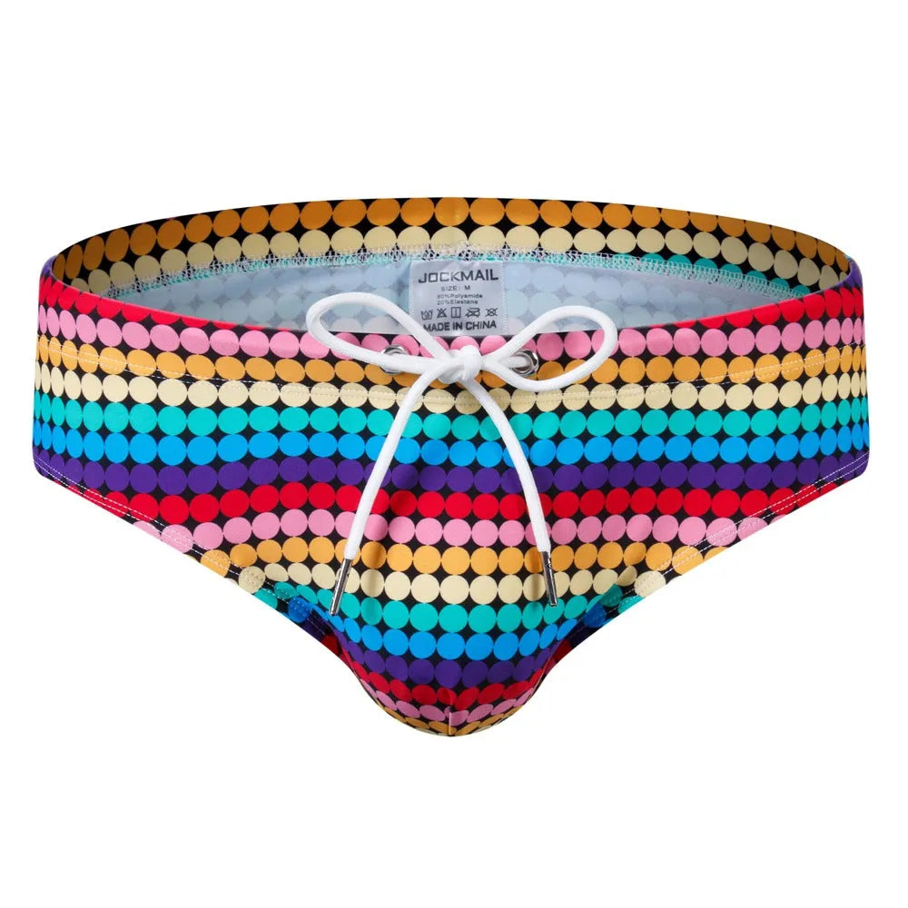 Men's low waist triangle nylon swimming trunks in solid colour with pattern, front view