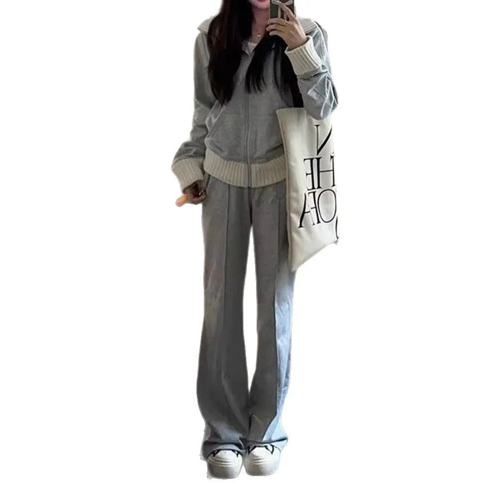 Light gray women's coat and wide leg trousers two-piece set with pockets on a plain background