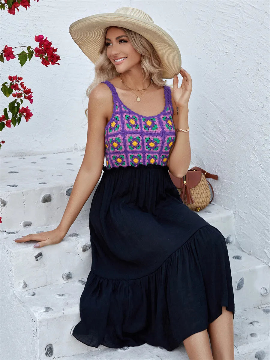Purple sleeveless dress with hand-hooked white floral embroidery, shown on a hanger.
