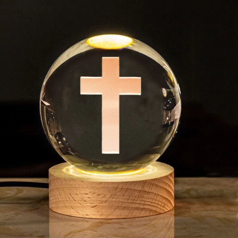 White crystal ball desk ornament with wood base and religious design inside