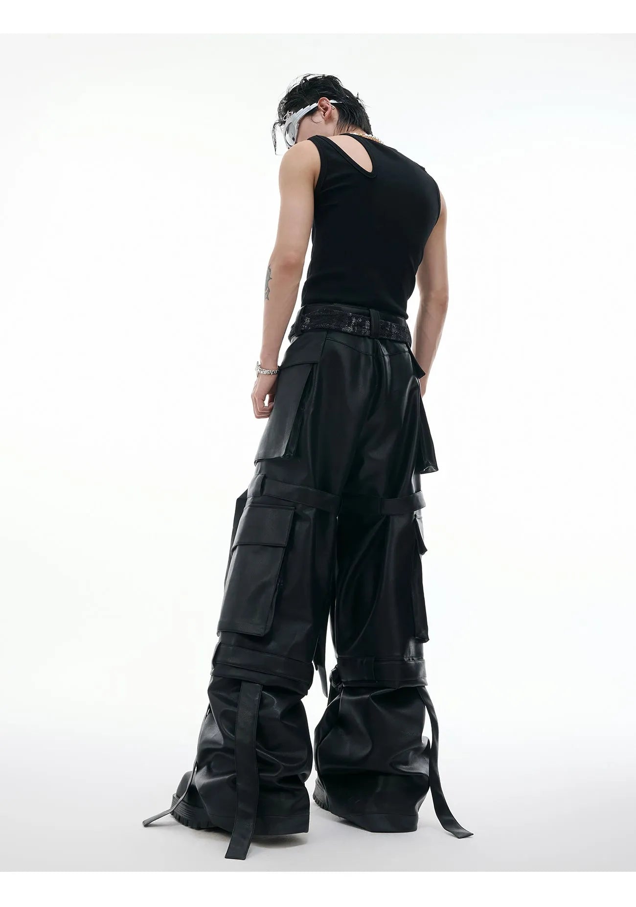Black quilted leather pants with multiple pockets and ribbon stitching detail
