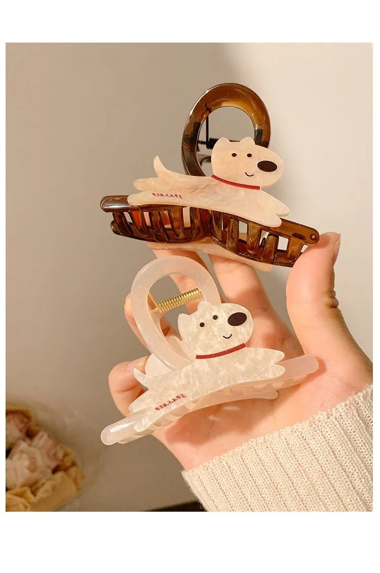Cute cartoon puppy shaped hair barrettes with a grip clip, shown in beige and brown colours.