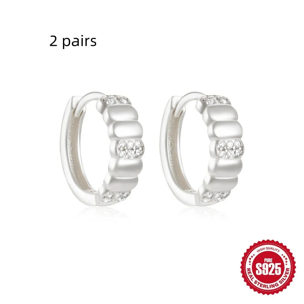 Small round geometric sterling silver stud earrings with diamond accents in gold or silver finish