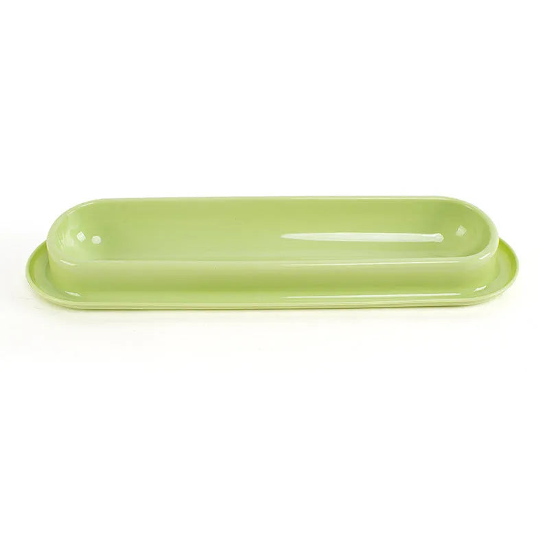 Green dual-compartment pet bowl with removable stainless steel insert and non-slip silicone base