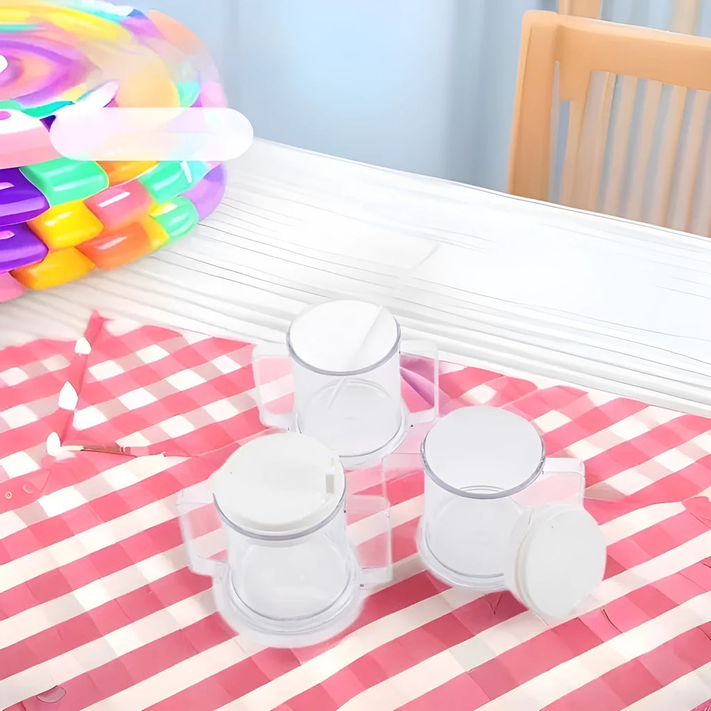 Transparent spill-proof plastic drinking cup with modern design on a plain background.