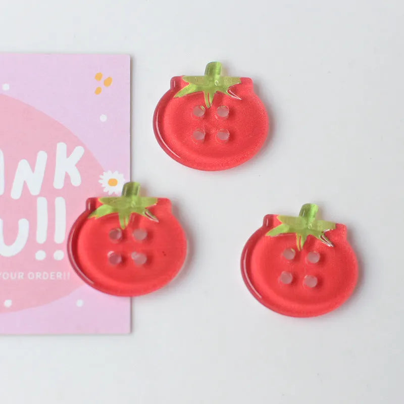 Plastic tomato button ornaments in cherry tomato printing, red plaid, solid red, and mixed colour designs