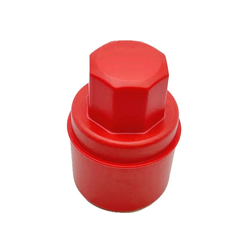 Black and red hand-held car tyre polishing sponge brushes with lids on a workbench.