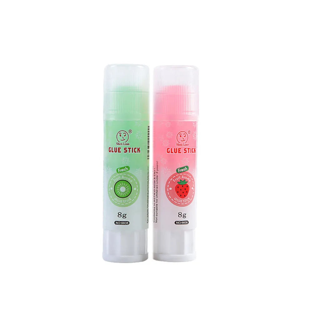 Two fruit-printed jelly solid glue sticks showing random colours and compact 8.5 cm size