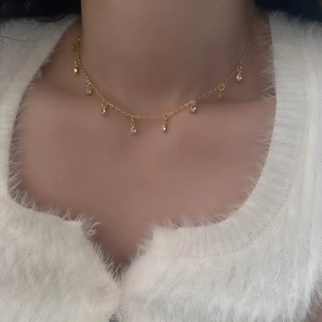 Silver-tone zircon jewellery set with geometric meteor shower pendant necklace, matching earrings and anklet