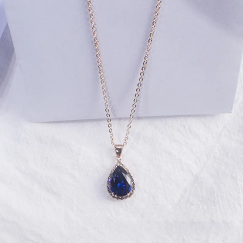 Women's drop-shaped pendant necklace with rhinestone geometric pattern in pink electroplated finish