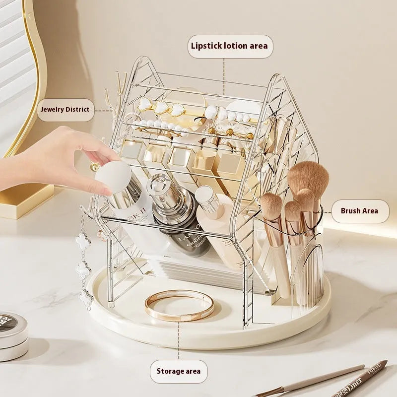 Rotating clear plastic cosmetics storage box with tiered compartments for brushes and bottles.