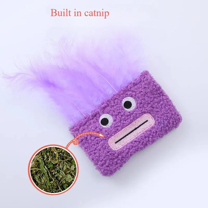 Colourful catnip plush toy with a funny big mouth explosion head shape on a blue background.