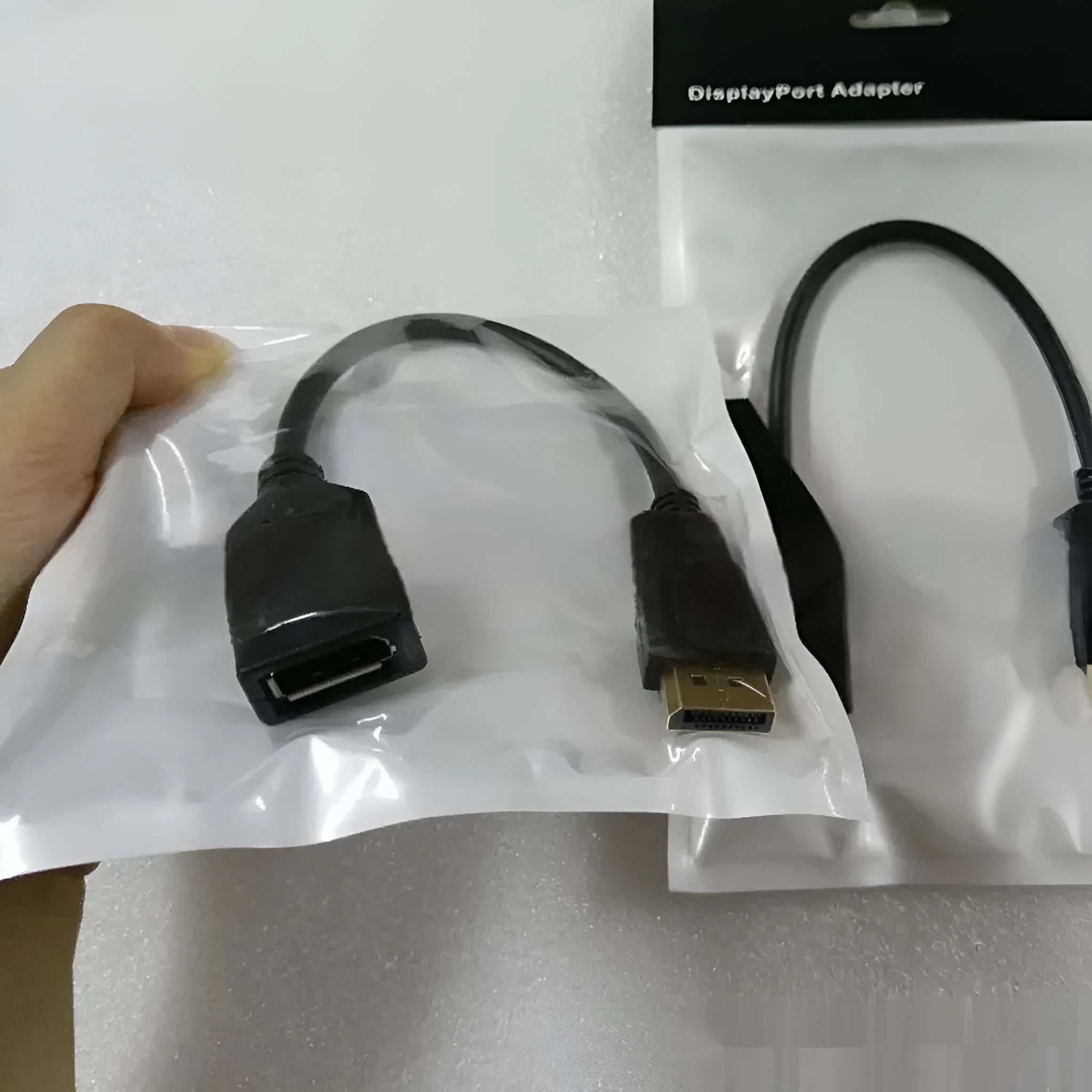 Black DisplayPort male to female extension cable with rotating DP busbar, 10cm length