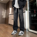 Men's loose fit straight-leg jeans in black or blue with drawstring waist closure