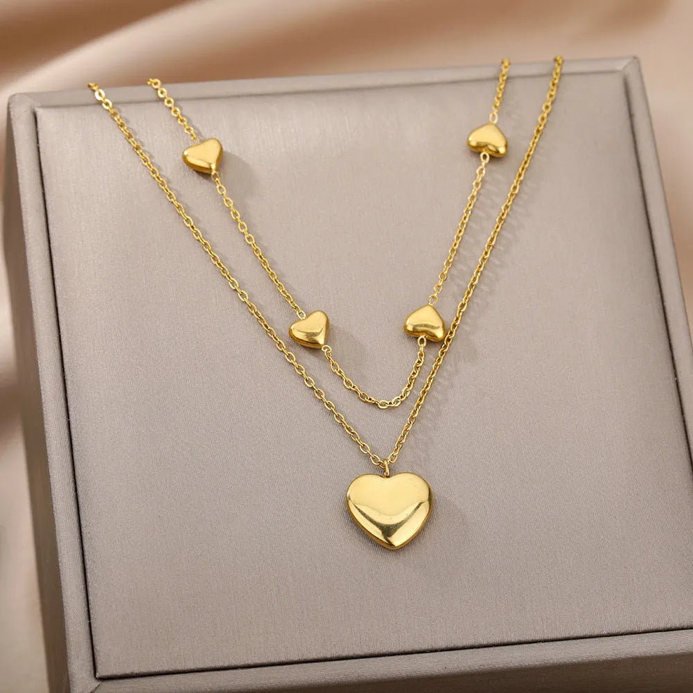 Multilayer heart pendant necklace with moon and star zircon accents on copper O-ring chain