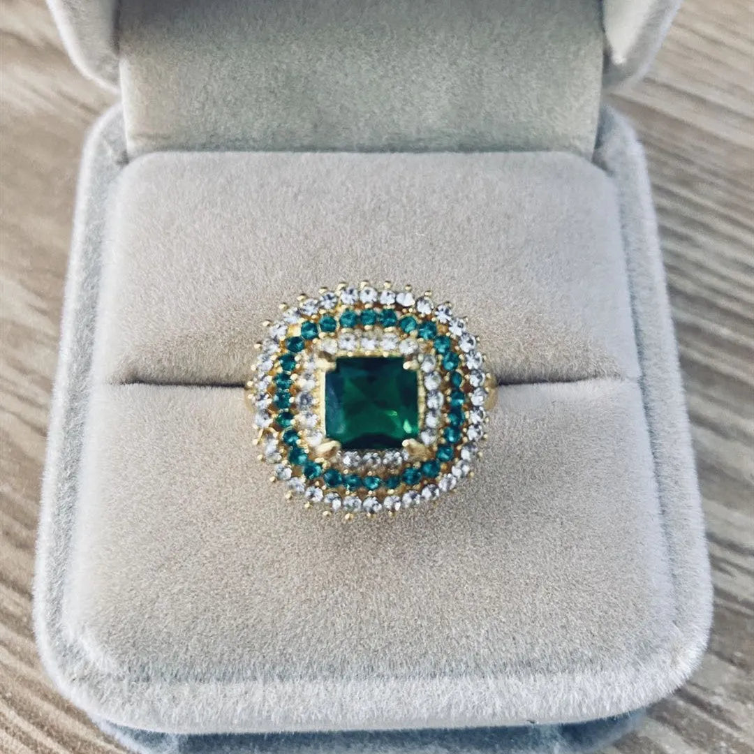 Emerald silver geometric metal ring ornament for women, shown on finger, size options available