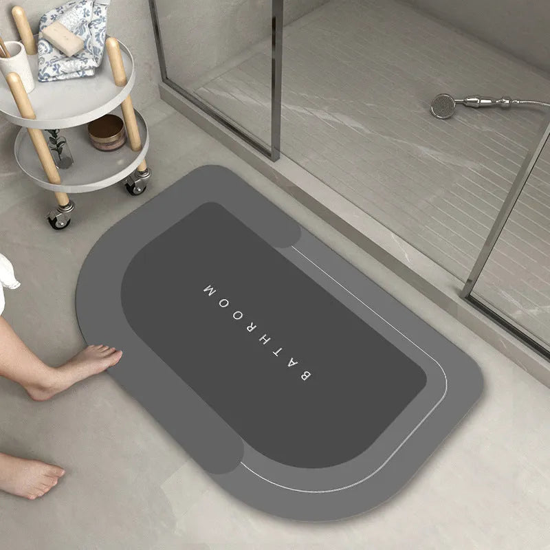 Blended fabric bathroom floor mat in blue, available in oval and rectangular shapes.