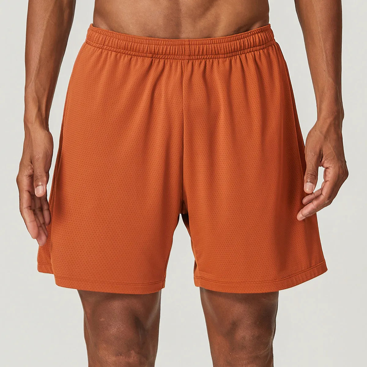 Men's quick-dry nylon double-layer running shorts in dark brown, shown laid flat.