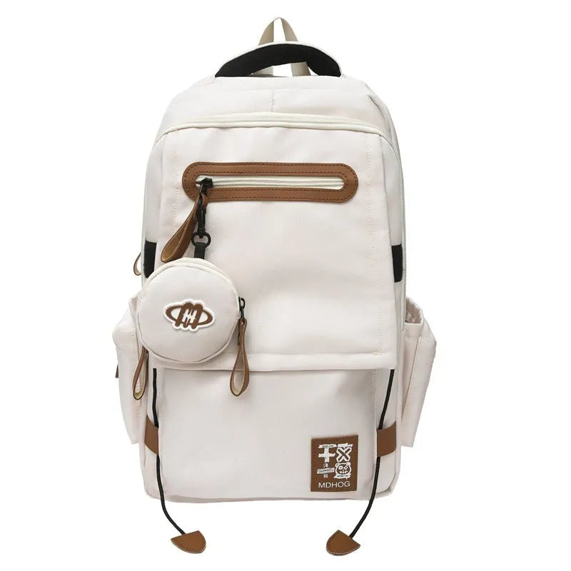 Large black waterproof nylon travel backpack with contrast stitching, shown with a 20-35L capacity.