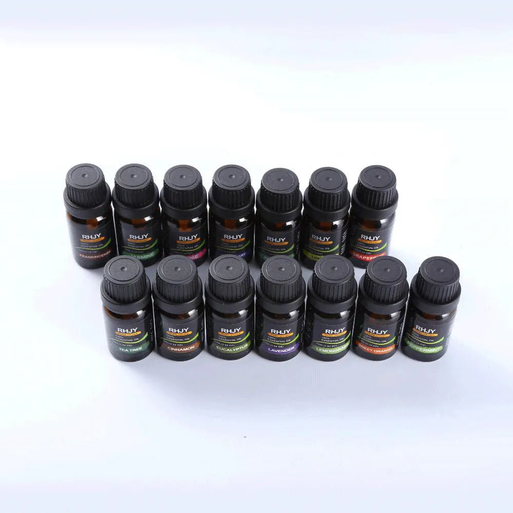 Essential oil set of 14 fragrances in 10ml bottles including rose, lavender, and lemon on a surface
