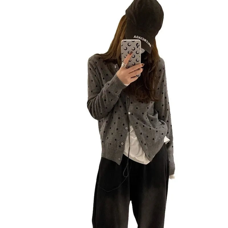 Women's grey Korean-style cardigan with crocheted flower detail on mannequin