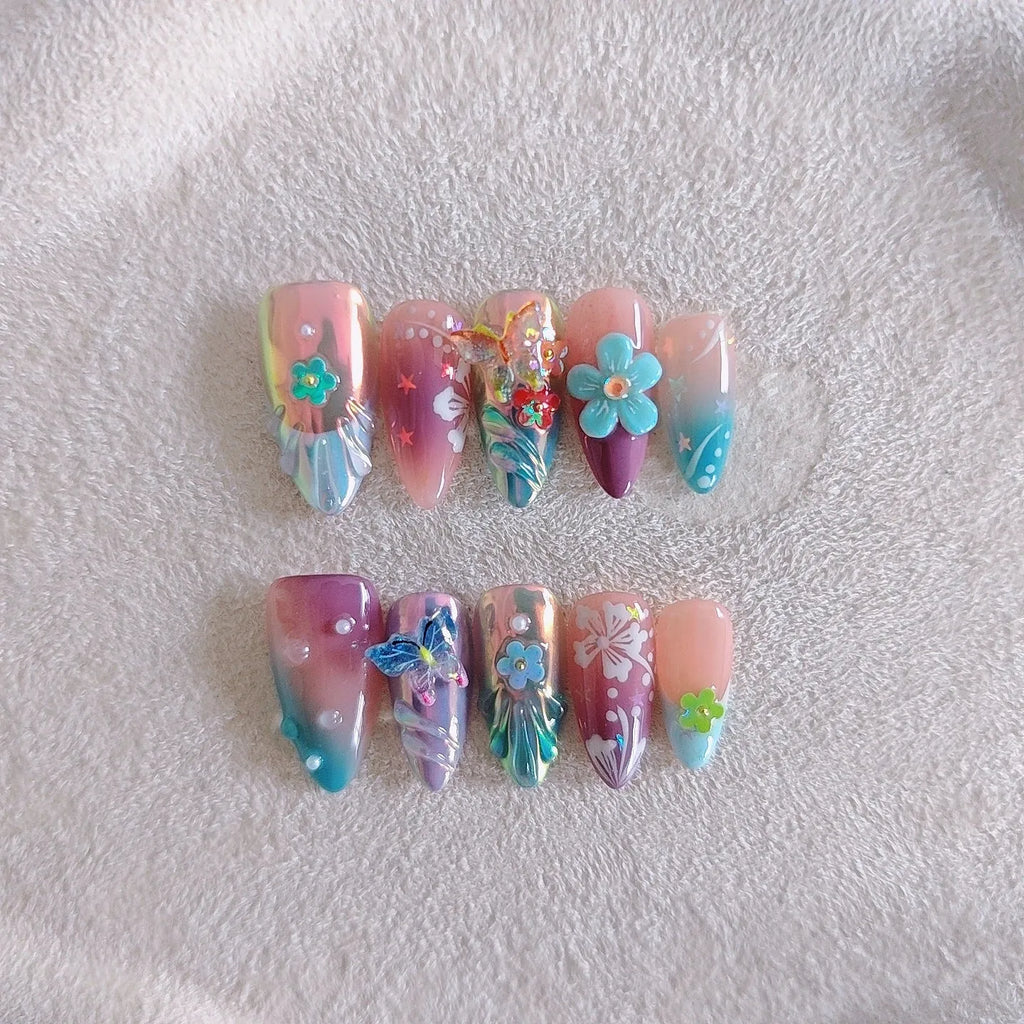Handmade small flower and butterfly nail art charms in assorted sizes for gel manicure decoration.