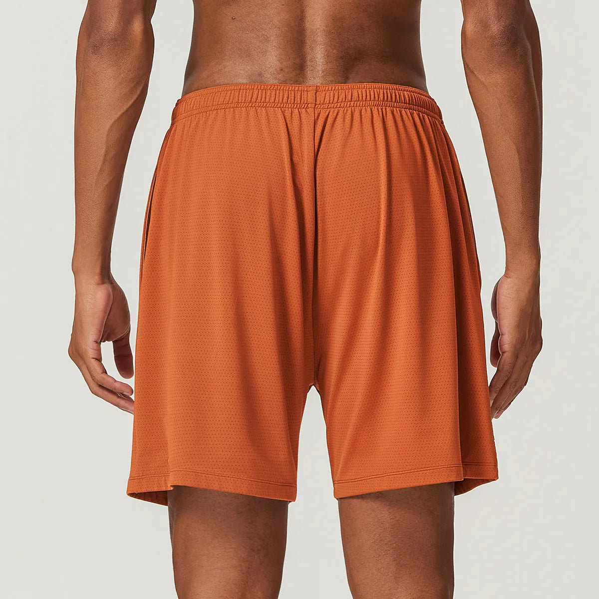 Men's quick-dry nylon double-layer running shorts in dark brown, shown laid flat.