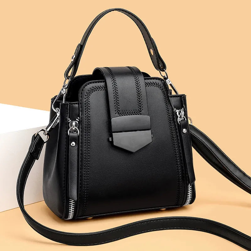 Square vertical PU leather handbag with textured finish and sewing thread detail in colour options