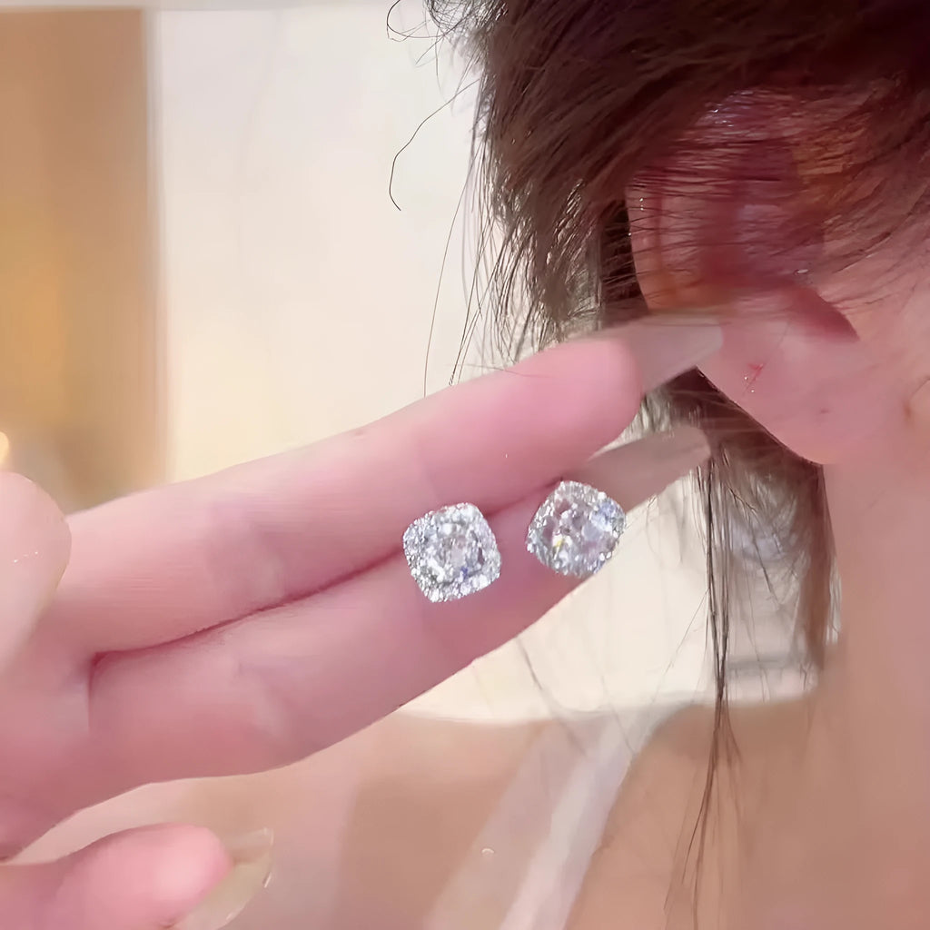 A pair of square geometric women's earrings with a diamond-treated surface in a gold colour option.