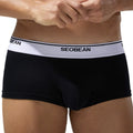Men's cotton low waist boxer shorts in solid colours on a white background.