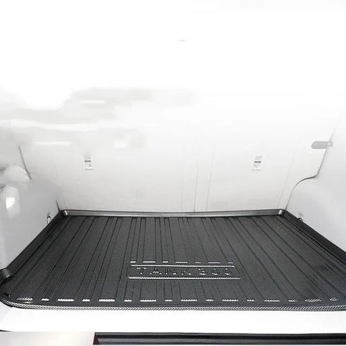 Black carbon fibre pattern TPE car boot liner mat for vehicle trunk protection.