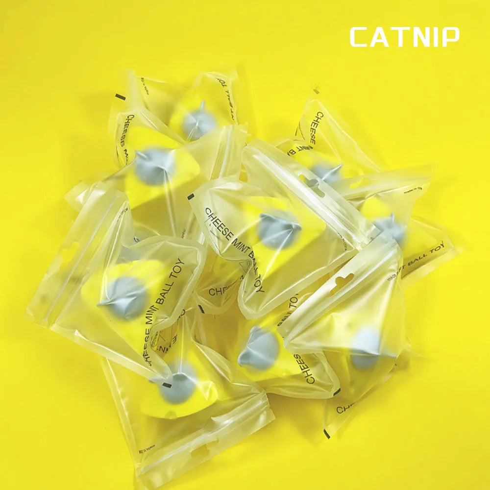 Yellow catnip and silvervine chew toy balls for indoor cat teeth cleaning