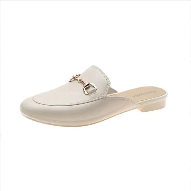 Women's PVC closed toe half slipper with metal buckle fastening in milky white.