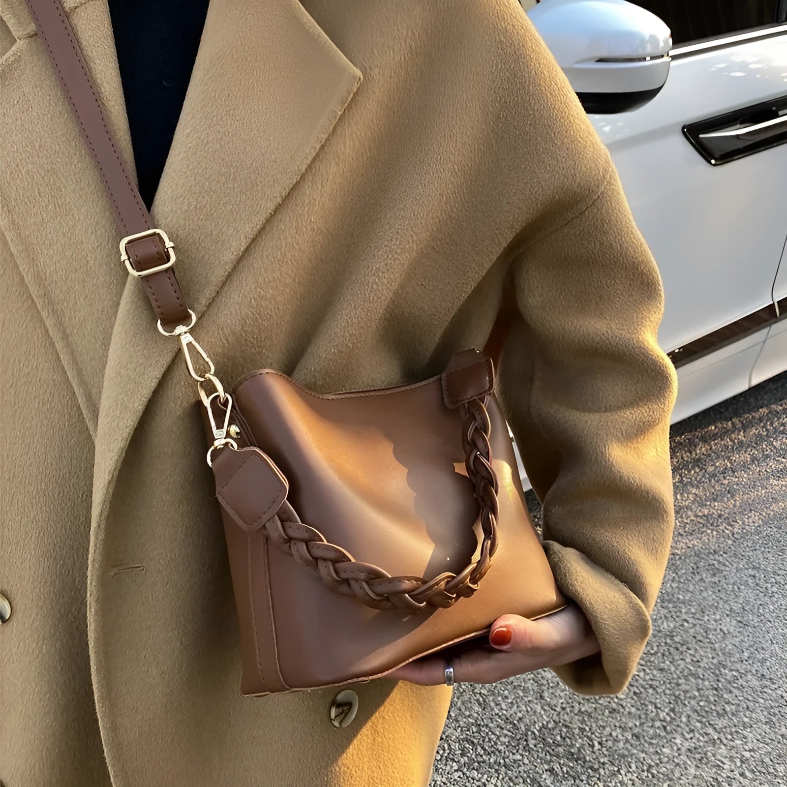 Retro woven PU leather bucket bag in khaki colour with crossbody strap.