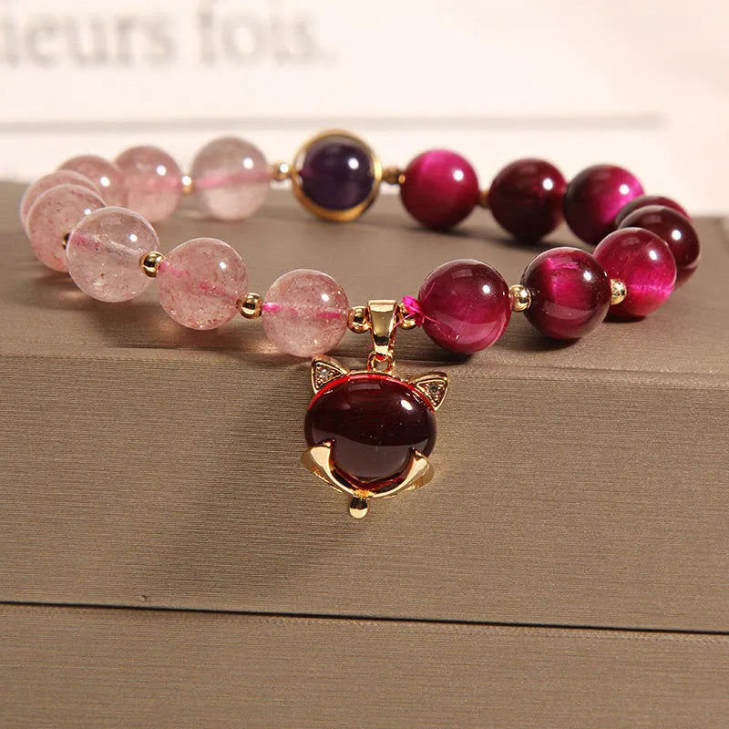 Women's simple strawberry crystal bracelet on an 18cm elastic band.