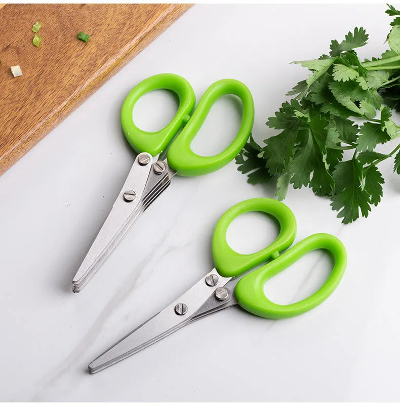 Green stainless steel multi-blade herb scissors with V-shaped design for cutting nori and green onions.