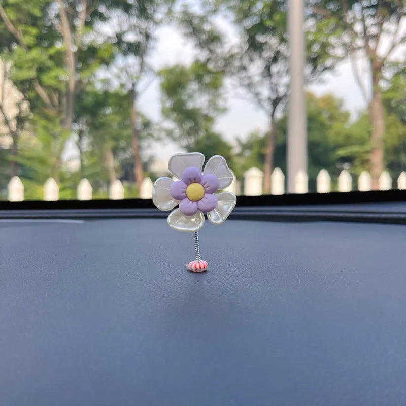 Cute plastic swing car decoration in blue, showing approximate 5cm height.