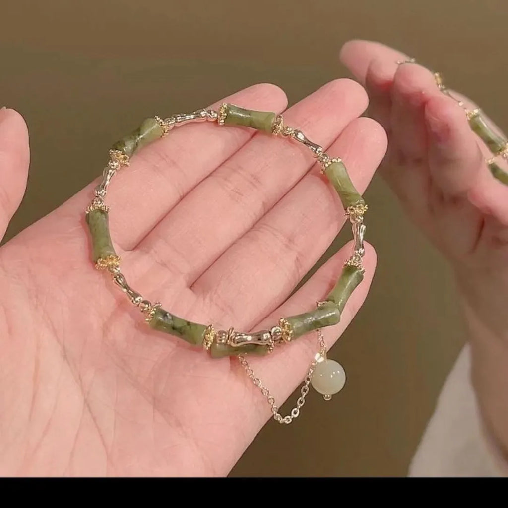 Women's bamboo bracelet with plum wine bamboo joints and coloured glaze beads on adjustable elastic cord