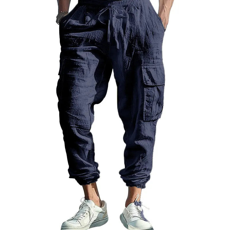 Men's casual linen trousers in solid colour with ankle ties and multiple pockets, loose fit, drawstring waist.