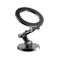 Car magnetic foldable metal bracket in black mounted on dashboard with phone attached