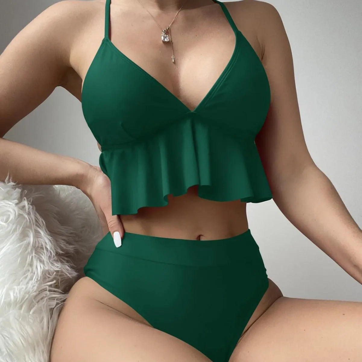 Women's solid colour bikini swimsuit showing sleeveless top and pants in available colours.