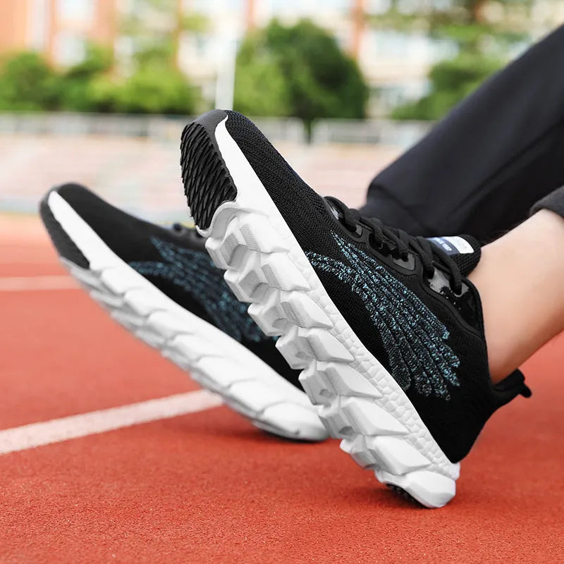 Women's low-top platform running sneakers in black and white colours with round toe and cross strap design