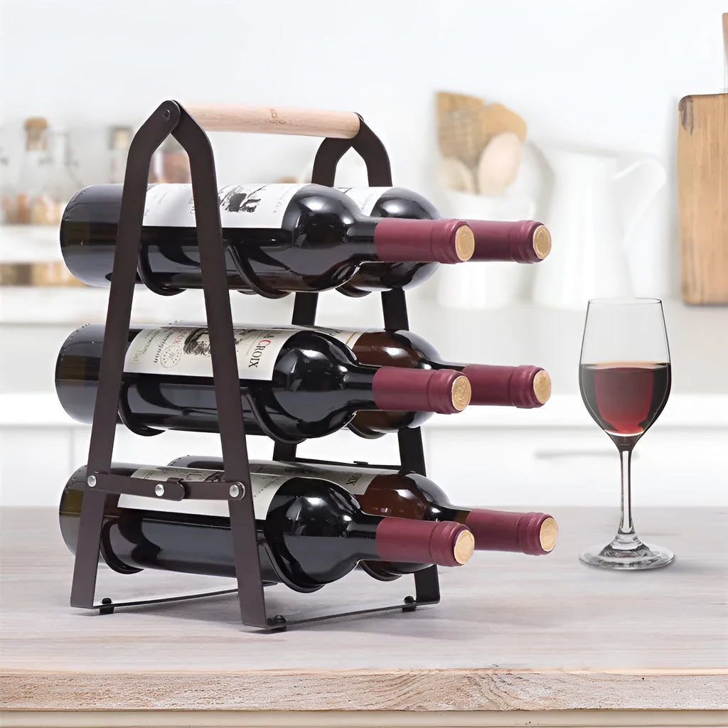 Black iron metallic desktop wine rack holding one wine bottle on a kitchen countertop