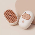 White and yellow rechargeable steam brush for grooming dogs and cats