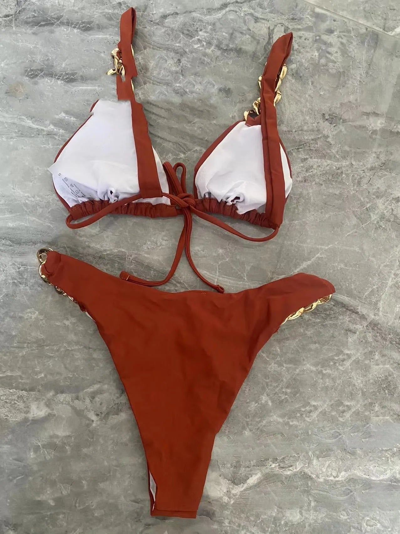 Brown tube-top push-up bikini swimsuit with ring detailing and split hem.