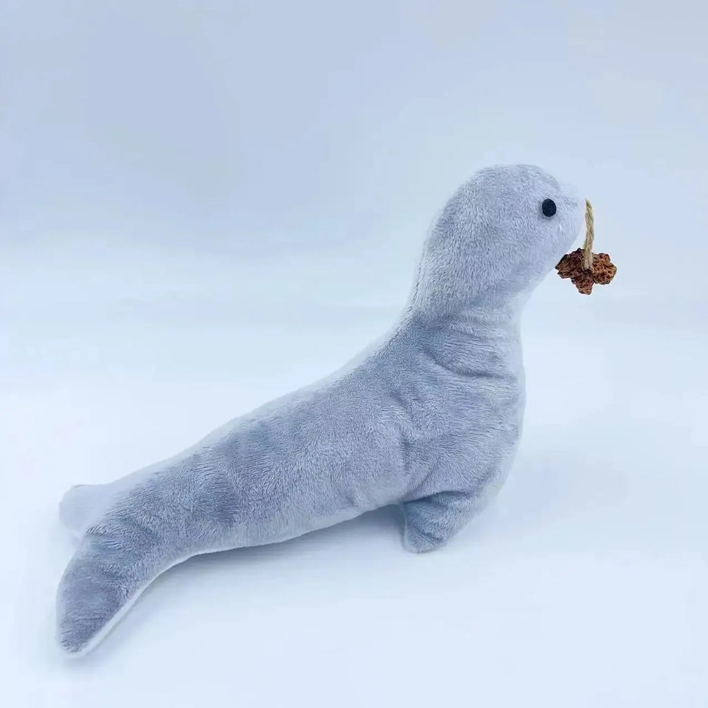 Blue sea lion shaped cat plush toy with bell sound feature and attached gall fruit teaser