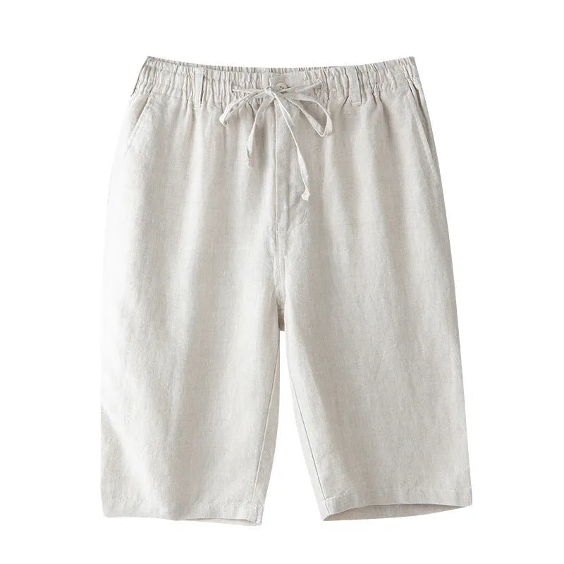 Men's loose-fitting linen capri trousers in a straight-leg style on a neutral background.