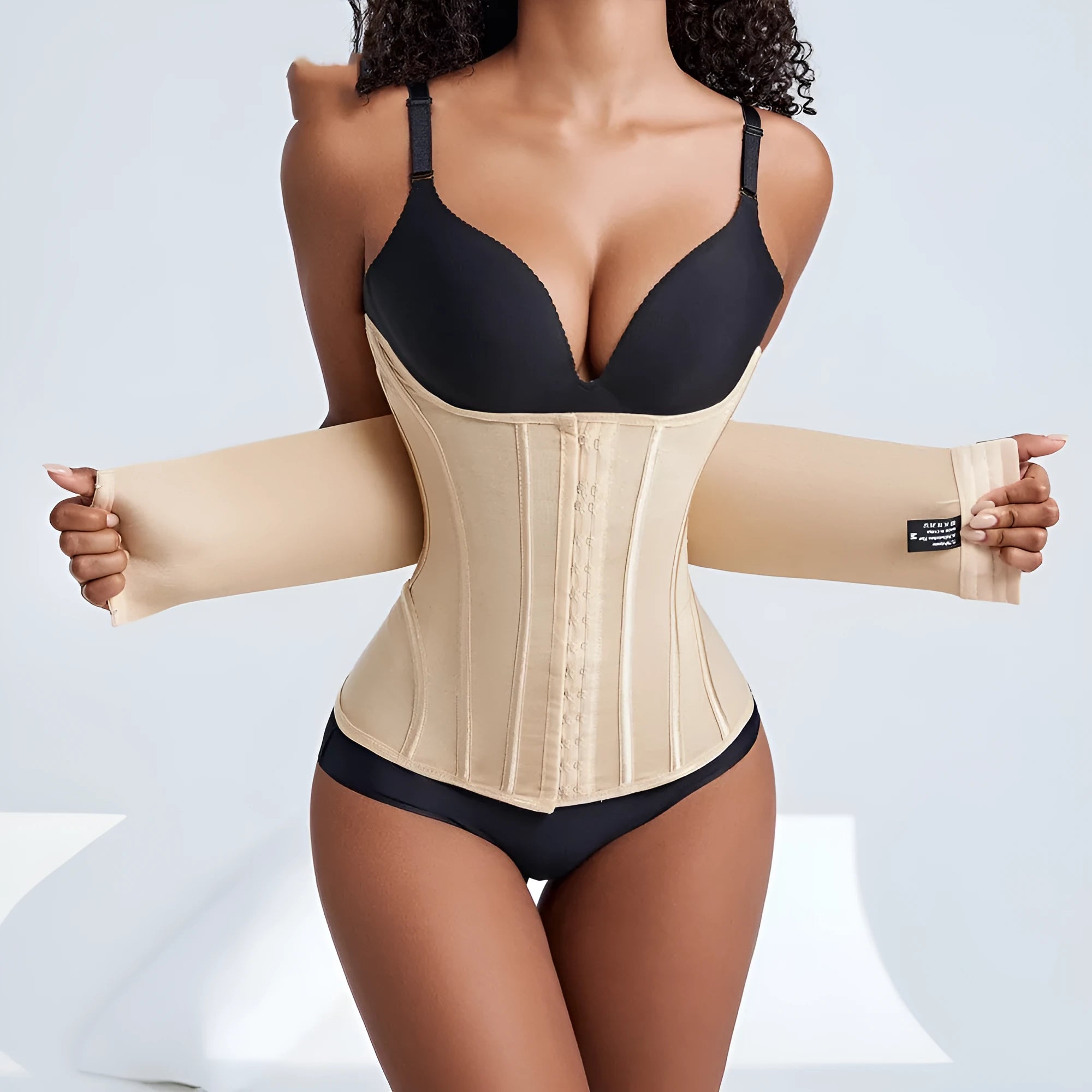 Nylon belly band waist trainer in black or apricot with belt tie fastener